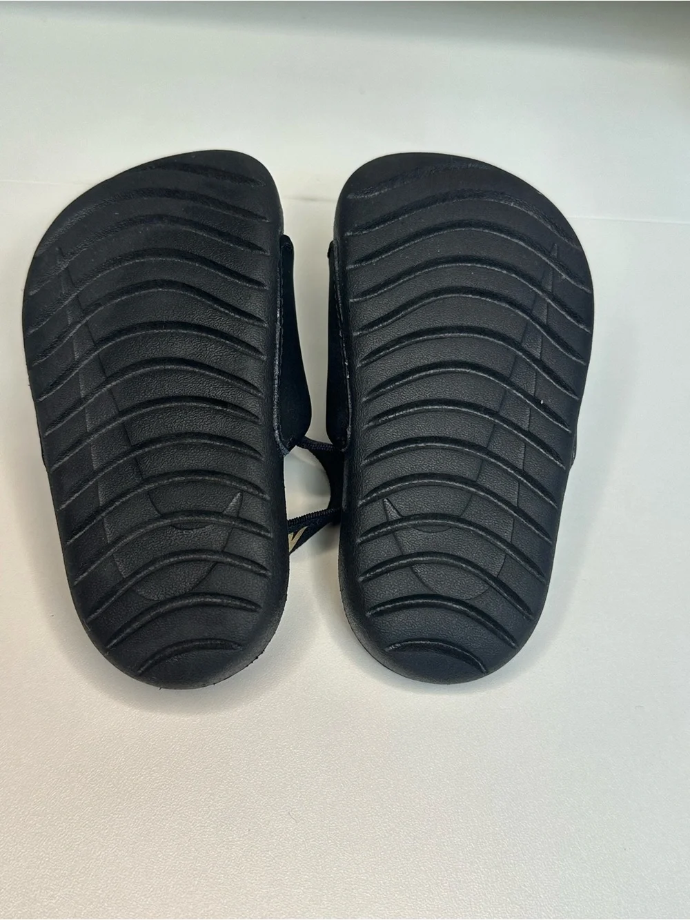 Nike Kids Black Slides with Gold Swoosh